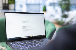 A laptop screen displaying an AI agent conversation, demonstrating how llms.txt helps models extract key information.